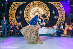 Indian bride and groom looking at each other while dance. Indian bride and groom looking at each other while dance.