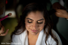 Lovely Indian bride getting her makeup done. Lovely Indian bride getting her makeup done.