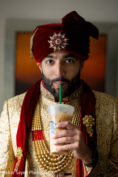 Indian groom getting an iced coffee. Indian groom getting an iced coffee.
