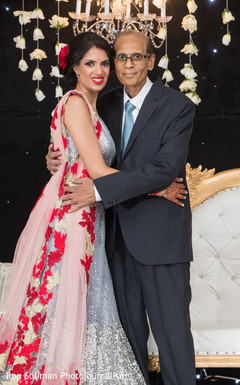 Lovely Indian bride posing with father. Lovely Indian bride posing with father.