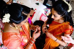Indian bride putting bangles capture. Indian bride putting bangles capture.