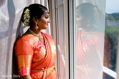 Enchanting Indian bride looking out the window. Enchanting Indian bride looking out the window.