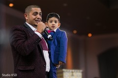 Indian groom with kid delivering a speech Indian groom with kid delivering a speech