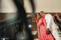 Indian bride and groom posing for the photo shoot Indian bride and groom posing for the photo shoot