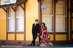 Indian couple outdoors taking pictures Indian couple outdoors taking pictures