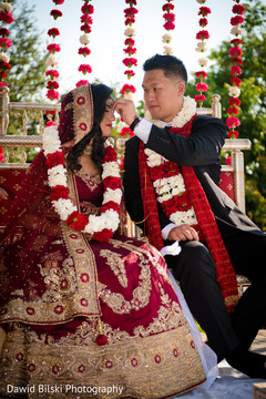 Indian bride and groom during the ceremonies Indian bride and groom during the ceremonies