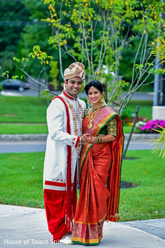Indian bride and groom outdoors on their wedding ceremony outfits. Indian bride and groom outdoors on their wedding ceremony outfits.