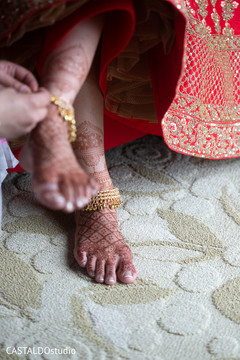 Maharani getting her anklets on. Maharani getting her anklets on.