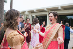 Joyful Indian bridesmaids at baraat procession capture. Joyful Indian bridesmaids at baraat procession capture.