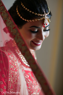 Elegant Indian bride with her tikka capture. Elegant Indian bride with her tikka capture.