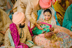 Tender moment during the Indian wedding rituals Tender moment during the Indian wedding rituals