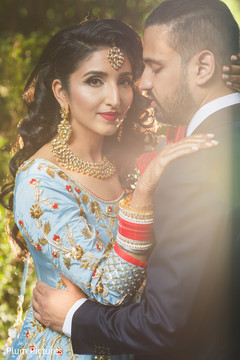 Lovely Indian couple in their reception outfits. Lovely Indian couple in their reception outfits.