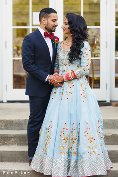 Lovely Indian couple in their reception outfits. Lovely Indian couple in their reception outfits.