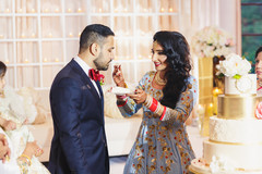 Indian bride giving cake to the groom lovely capture. Indian bride giving cake to the groom lovely capture.