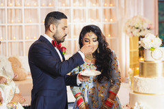 Lovely capture Indian groom giving cake to the bride. Lovely capture Indian groom giving cake to the bride.