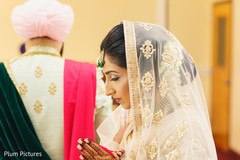 Indian bride and groom take their rounds around the sacred fire. Indian bride and groom take their rounds around the sacred fire.