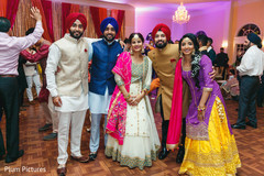 Elegant Indian bride and groom with relatives capture. Elegant Indian bride and groom with relatives capture.