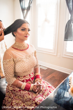 Indian bride getting her hair done. Indian bride getting her hair done.