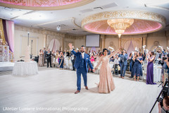 Impressive indian bride and groom's reception entrance. Impressive indian bride and groom's reception entrance.