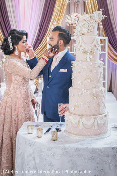 Lovely capture Indian bride and groom eating cake together. Lovely capture Indian bride and groom eating cake together.