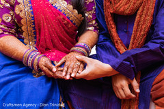 Indian groom admiring Maharani's mehndi design Indian groom admiring Maharani's mehndi design