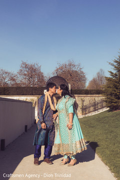 Indian bride and groom kissing outdoors Indian bride and groom kissing outdoors