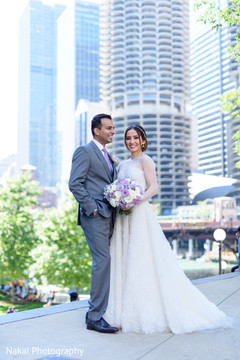 Amazing shot of the newlyweds smiling outdoors Amazing shot of the newlyweds smiling outdoors