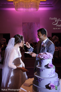 Indian groom sharing a slice of cake with the Maharani Indian groom sharing a slice of cake with the Maharani
