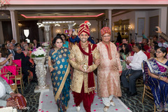 Indian groom escorted by his parents Indian groom escorted by his parents