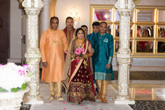 Indian bride escorted by her family making her entrance Indian bride escorted by her family making her entrance
