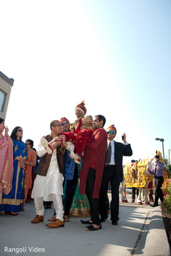 Indian groom being lifted by special guests during the baraat Indian groom being lifted by special guests during the baraat