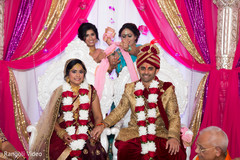 Stunning capture of Indian bride and groom wearing the garlands Stunning capture of Indian bride and groom wearing the garlands