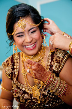 Joyful Maharani being assisted with the jewelry Joyful Maharani being assisted with the jewelry