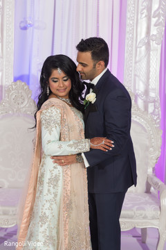 Indian bride and groom holding each other Indian bride and groom holding each other