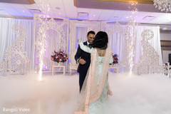 Indian bride and groom having their first dance Indian bride and groom having their first dance