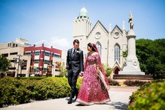 Indian bride and groom holding hands outdoors Indian bride and groom holding hands outdoors