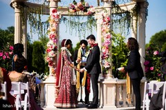 Indian couple holding hands during the ceremony Indian couple holding hands during the ceremony