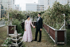 Maharani and Raja holding hands outdoors during the photo shoot Maharani and Raja holding hands outdoors during the photo shoot