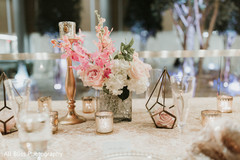 Floral arrangement details on the table at the reception Floral arrangement details on the table at the reception