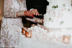 Indian bride and groom cutting the cake Indian bride and groom cutting the cake