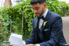 Elegant Indian groom reading Maharani's letter Elegant Indian groom reading Maharani's letter