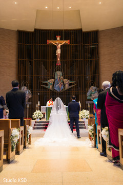 Beautiful shot of the lovebirds at the aisle Beautiful shot of the lovebirds at the aisle