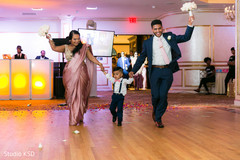 Special guests and kid entering the reception venue Special guests and kid entering the reception venue