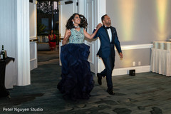 Indian couples grand entrance to reception.