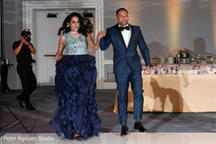 Ravishing indian bride  and groom entrance to wedding reception.