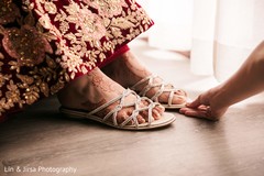 Gorgeous Indian bride wearing her ceremony shoes. Gorgeous Indian bride wearing her ceremony shoes.