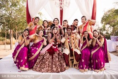 Indian bride, groom and bridesmaids looking at camera. Indian bride, groom and bridesmaids looking at camera.