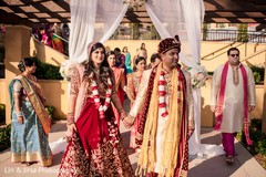Indian bride and groom walking out from the ceremony. Indian bride and groom walking out from the ceremony.