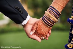 Indian couple walking holding hands closeup. Indian couple walking holding hands closeup.