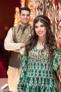 Indian couple posing for pictures at the venue Indian couple posing for pictures at the venue